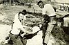 SFC_ belewag_holding_ sandbag.jpg
