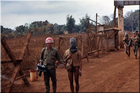 Viet Cong prisonors, with hands being led into Pli Me_edited.jpg